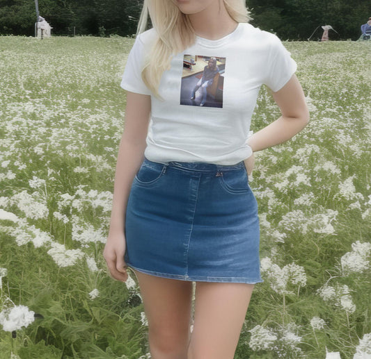 A coquette girl wearing a white t-shirt with a graphic of Layla from Buffalo 66.